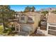 Exterior view of well-maintained home with desert landscaping and a two-car garage at 3425 Creek River Dr, Las Vegas, NV 89129