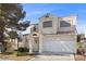 Inviting two-story home with a classic design, front lawn, and attached two-car garage at 3425 Creek River Dr, Las Vegas, NV 89129