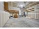 Spacious garage with ample storage cabinets, workbench area, and epoxy-coated flooring at 3425 Creek River Dr, Las Vegas, NV 89129
