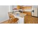 Kitchen view showcasing a breakfast bar, stainless steel appliances, and granite countertops at 3425 Creek River Dr, Las Vegas, NV 89129