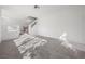 Spacious living room with carpet, staircase, and abundant natural light streaming through the windows at 3425 Creek River Dr, Las Vegas, NV 89129