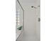 Tiled shower with glass door and glass block window for natural light at 3425 Creek River Dr, Las Vegas, NV 89129