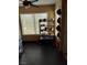 Well-lit kitchen area with organized storage and modern black tile flooring at 3425 E Russell Rd # 161, Las Vegas, NV 89120