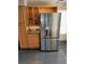 Stainless steel refrigerator and wood cabinets provide ample kitchen storage at 3425 E Russell Rd # 161, Las Vegas, NV 89120