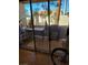 Outdoor patio with a grill and plants seen through sliding glass doors at 3425 E Russell Rd # 161, Las Vegas, NV 89120