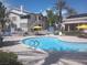 Lounge poolside at the community pool, complete with shaded seating, greenery, and immaculate landscaping at 3425 E Russell Rd # 161, Las Vegas, NV 89120