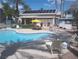 A beautiful community pool with lounge chairs, dining table, and BBQ for outdoor entertaining at 3425 E Russell Rd # 161, Las Vegas, NV 89120