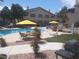 Community pool and barbecue area including outdoor seating for Gathering gatherings on a sunny day at 3425 E Russell Rd # 161, Las Vegas, NV 89120