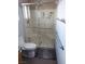 Bright shower with glass doors, built-in seating, and modern fixtures at 3425 E Russell Rd # 161, Las Vegas, NV 89120