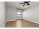 Clean bedroom featuring a ceiling fan, wood-look floors, and a window at 3608 Pintadas St # 204, Las Vegas, NV 89108