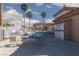 Community pool area with palm trees, lounge chairs and a shower at 3608 Pintadas St # 204, Las Vegas, NV 89108