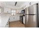 Updated kitchen featuring white cabinets, stainless appliances, and modern fixtures at 3608 Pintadas St # 204, Las Vegas, NV 89108