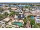 Aerial view of a solar-paneled home with a private pool and patio area, surrounded by lush palm trees at 3619 Bixbee Ct, Las Vegas, NV 89129