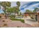 A beautifully landscaped backyard features a covered patio, an outdoor kitchen, and a sparkling in-ground pool at 3619 Bixbee Ct, Las Vegas, NV 89129