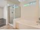 Bathroom with a shower, tub and window letting in natural light at 3619 Bixbee Ct, Las Vegas, NV 89129
