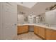 Bright bathroom features dual sinks, custom lighting and tiled floors at 3619 Bixbee Ct, Las Vegas, NV 89129