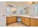 Well-lit bathroom featuring dual sinks, ample counter space, and neutral decor at 3619 Bixbee Ct, Las Vegas, NV 89129