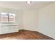 Bedroom featuring hardwood floors and a built-in cabinet at 3619 Bixbee Ct, Las Vegas, NV 89129
