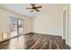 Bedroom with hardwood floors and sliding glass door leading to an outdoor area at 3619 Bixbee Ct, Las Vegas, NV 89129
