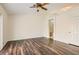 Bright bedroom with hardwood floors, ceiling fan, and easy access to the bathroom at 3619 Bixbee Ct, Las Vegas, NV 89129