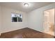 Bedroom features hardwood floors and an ensuite bathroom with a tiled floor at 3619 Bixbee Ct, Las Vegas, NV 89129