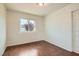 Bedroom with hardwood floors and a view of the outside scenery through the window at 3619 Bixbee Ct, Las Vegas, NV 89129