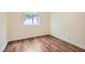 Bright bedroom featuring hardwood floors and a window providing natural light at 3619 Bixbee Ct, Las Vegas, NV 89129