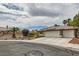 Charming home with a two-car garage, desert landscaping, and a paved driveway at 3619 Bixbee Ct, Las Vegas, NV 89129