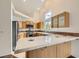 Bright kitchen with stainless steel appliances, tile countertops, and ample storage space at 3619 Bixbee Ct, Las Vegas, NV 89129
