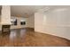 Cozy living room featuring fireplace, hardwood floors and modern chandelier at 3619 Bixbee Ct, Las Vegas, NV 89129