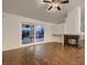 Bright living room featuring a stylish fireplace, sliding glass doors, and attractive wood floors at 3619 Bixbee Ct, Las Vegas, NV 89129