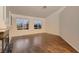 Bright living room featuring fireplace, hardwood floors and large windows at 3619 Bixbee Ct, Las Vegas, NV 89129