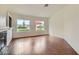 Cozy living area featuring a fireplace and two windows that offer plenty of natural light at 3619 Bixbee Ct, Las Vegas, NV 89129