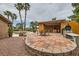 An outdoor kitchen and in-ground pool are perfect for entertaining in your private outdoor space with pavers and gravel at 3619 Bixbee Ct, Las Vegas, NV 89129