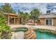 Inviting backyard pool with a hot tub, diving rocks, and an outdoor entertaining area at 3619 Bixbee Ct, Las Vegas, NV 89129