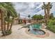 Enjoy the sparkling pool and spa in a serene backyard setting with lush landscaping at 3619 Bixbee Ct, Las Vegas, NV 89129