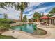 Stunning backyard pool with water features and an outdoor dining area for relaxing and entertaining at 3619 Bixbee Ct, Las Vegas, NV 89129