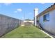 This backyard features a well-maintained lawn area and includes a relaxing hot tub for enjoying outdoor leisure at 3808 Lilac Haze St, Las Vegas, NV 89147
