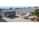 This backyard patio features a hot tub, lounge chairs, and a desert plant for relaxation and enjoyment at 3808 Lilac Haze St, Las Vegas, NV 89147