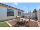 Outdoor seating area in the backyard, with gravel landscaping and ample space for relaxing and entertaining at 3808 Lilac Haze St, Las Vegas, NV 89147