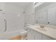 Well-lit bathroom featuring a shower-tub combo and a vanity with a large mirror at 3808 Lilac Haze St, Las Vegas, NV 89147