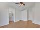 A spacious bedroom features wood flooring, ceiling fan, and access to an ensuite bathroom for added convenience at 3808 Lilac Haze St, Las Vegas, NV 89147