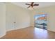 Bright bedroom with wood floors, ceiling fan, and sliding glass doors that offer tranquil views of the pool at 3808 Lilac Haze St, Las Vegas, NV 89147