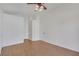 This well-lit bedroom offers ample space with wood flooring and a ceiling fan, ideal for comfortable living at 3808 Lilac Haze St, Las Vegas, NV 89147
