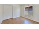 Bright bedroom with wood-look flooring, closet, and window offering natural light at 3808 Lilac Haze St, Las Vegas, NV 89147