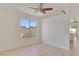 Bright room featuring neutral tile floors and abundant natural light at 3808 Lilac Haze St, Las Vegas, NV 89147