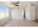 Large living room featuring neutral tile floors and abundant natural light at 3808 Lilac Haze St, Las Vegas, NV 89147