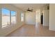 Spacious living room featuring neutral paint, tile flooring, and large windows at 3808 Lilac Haze St, Las Vegas, NV 89147