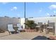 This cozy patio is equipped with lounge chairs, seating, and a decorative plant, creating a relaxing outdoor space at 3808 Lilac Haze St, Las Vegas, NV 89147