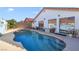 The backyard pool is surrounded by a well-kept patio, perfect for outdoor relaxation and recreation at 3808 Lilac Haze St, Las Vegas, NV 89147